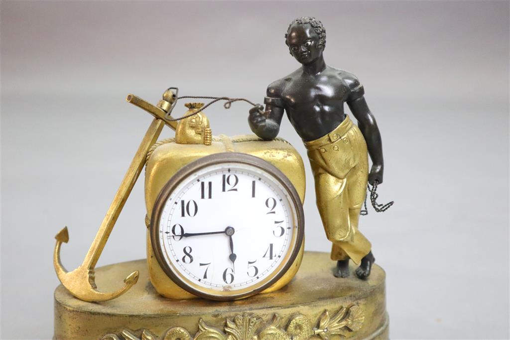 A 19th century French Empire bronze and ormolu mantel timepiece, width 6.5in. height 7.25in.